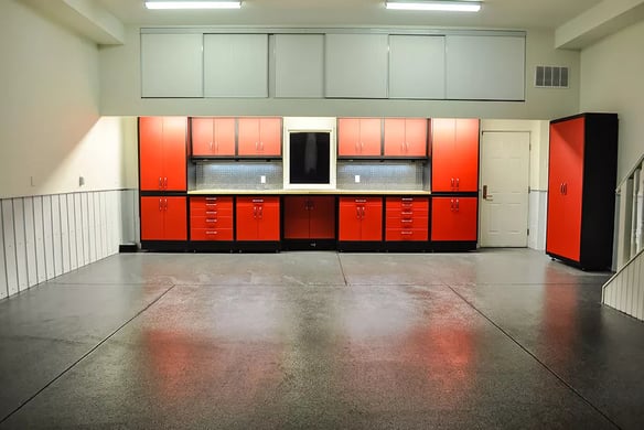 Custom Steel cabinetry with red high gloss finish- Garage Makeover before by Garage Living